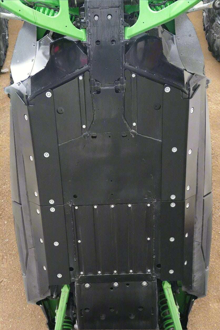 Close-up of a vehicle's undercarriage with visible suspension and body rock slider