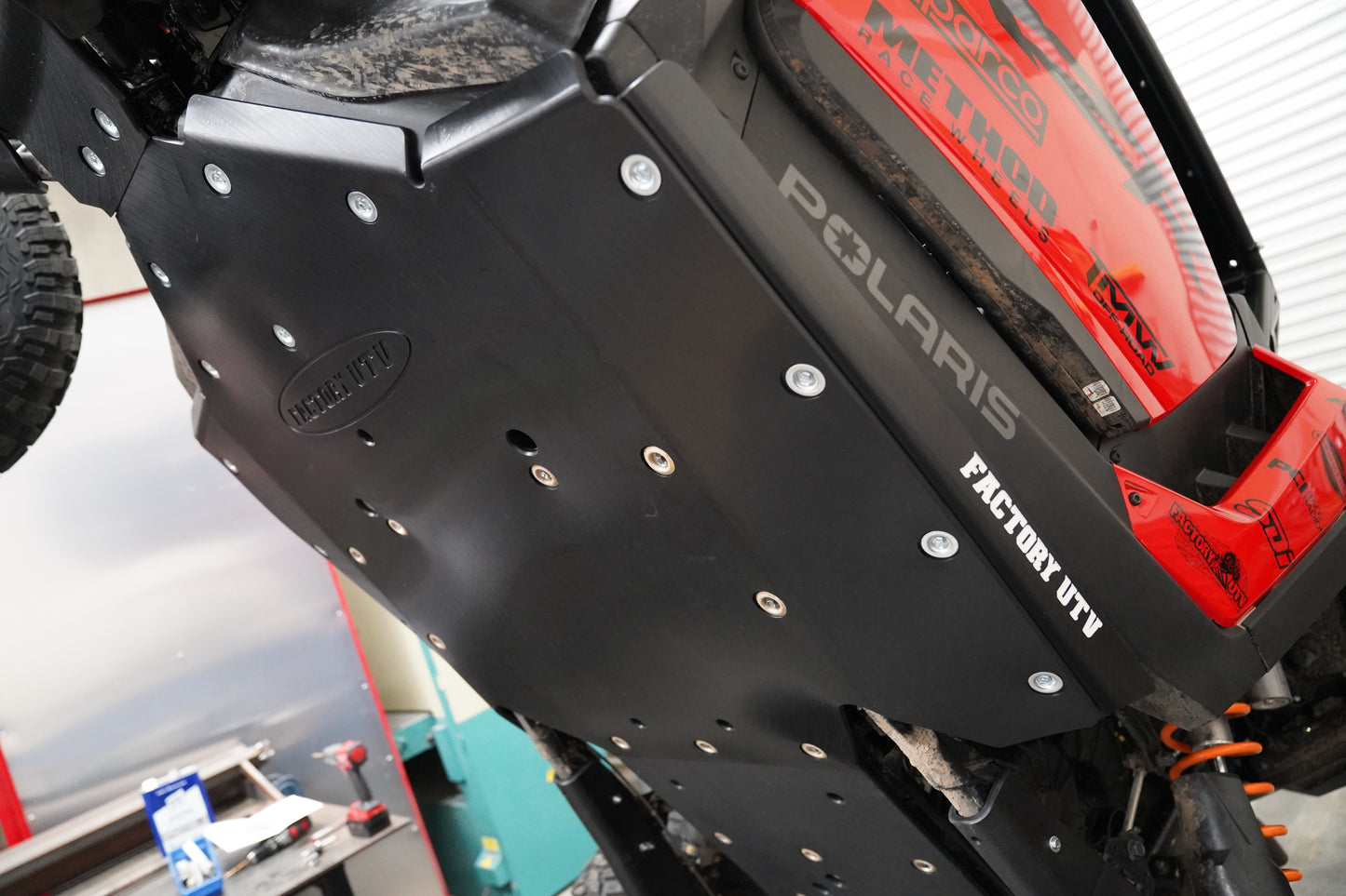 Side angle view of UHMW skid plate installed on Polaris RZR XP S 1000