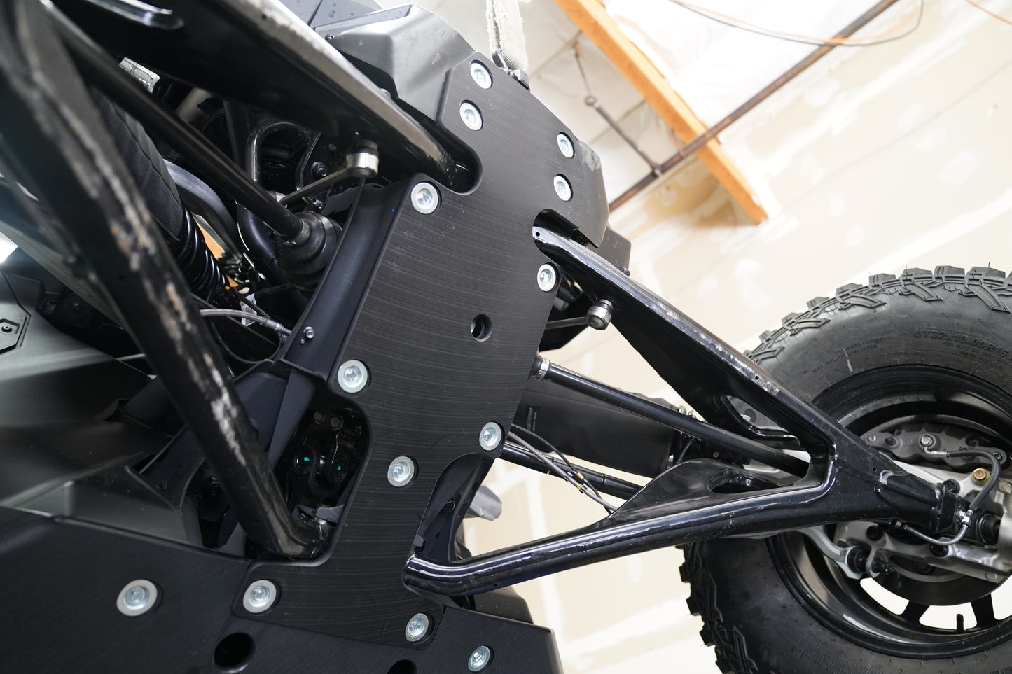 Detail shot showing UHMW skid plate construction and mounting points