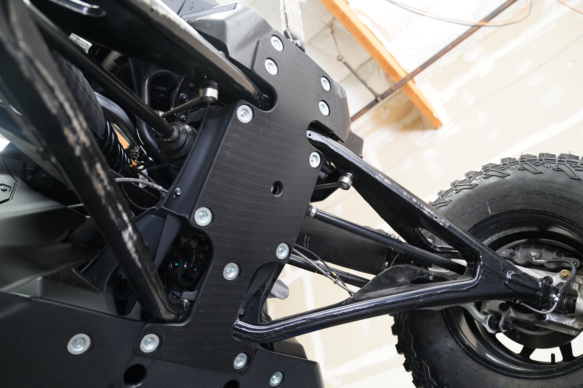 Detail shot showing UHMW skid plate construction and mounting points