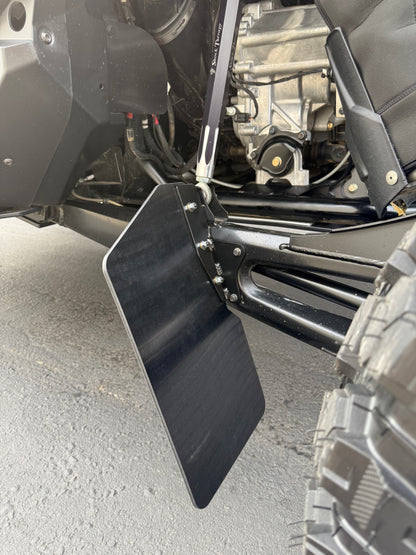Side angle view showing full UHMW rock deflector coverage on RZR Pro R