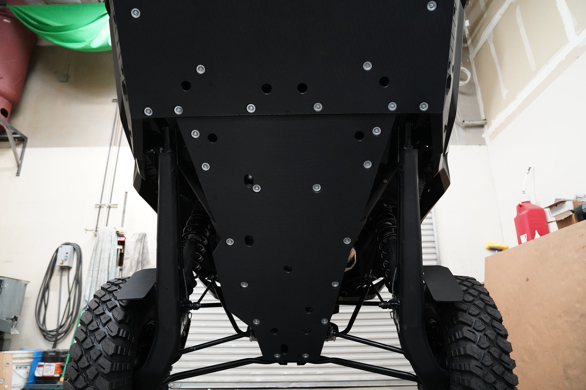 Factory UTV aluminum X-Brace upgrade installed with UHMW skid plate