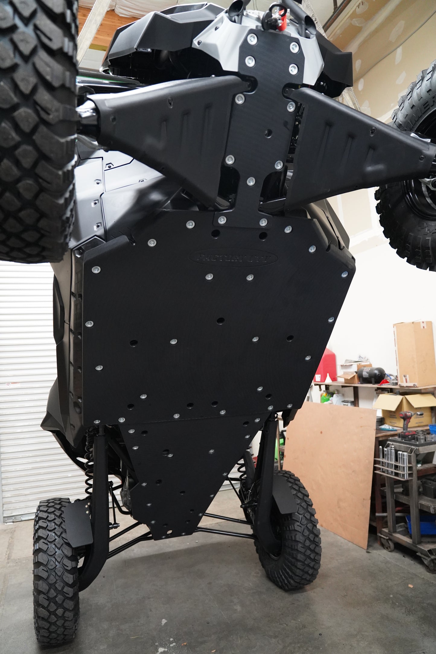 Bottom view showing full undercarriage protection for Can-Am Maverick R X RC