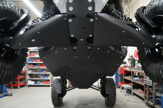 Front angle of UTV with Factory UTV UHMW skid plates providing full front-end protection.