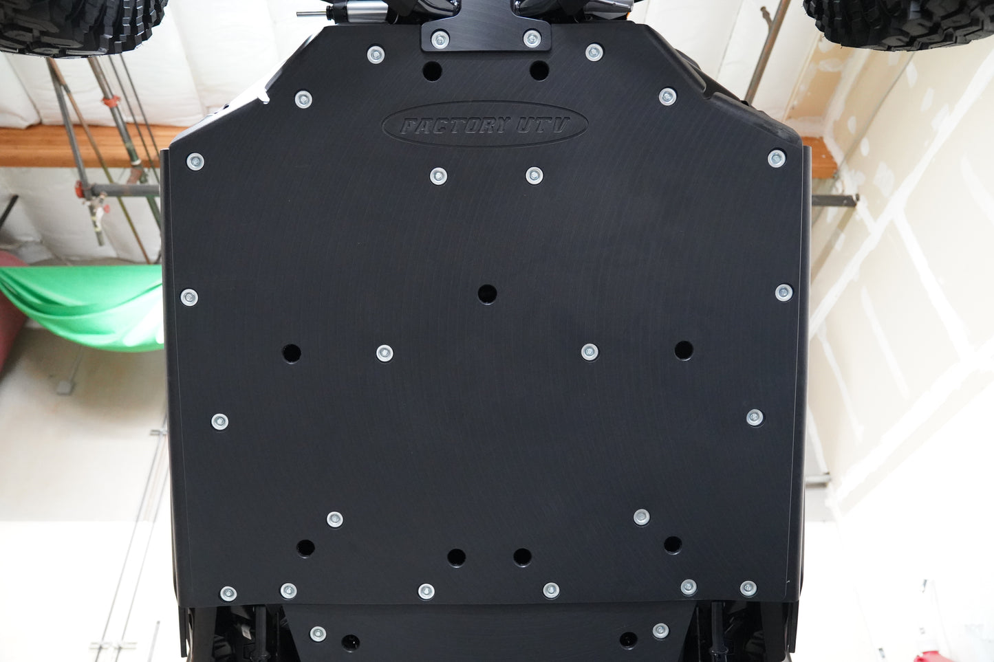 Close-up view of Factory UTV UHMW skid plate material highlighting thickness and durability.