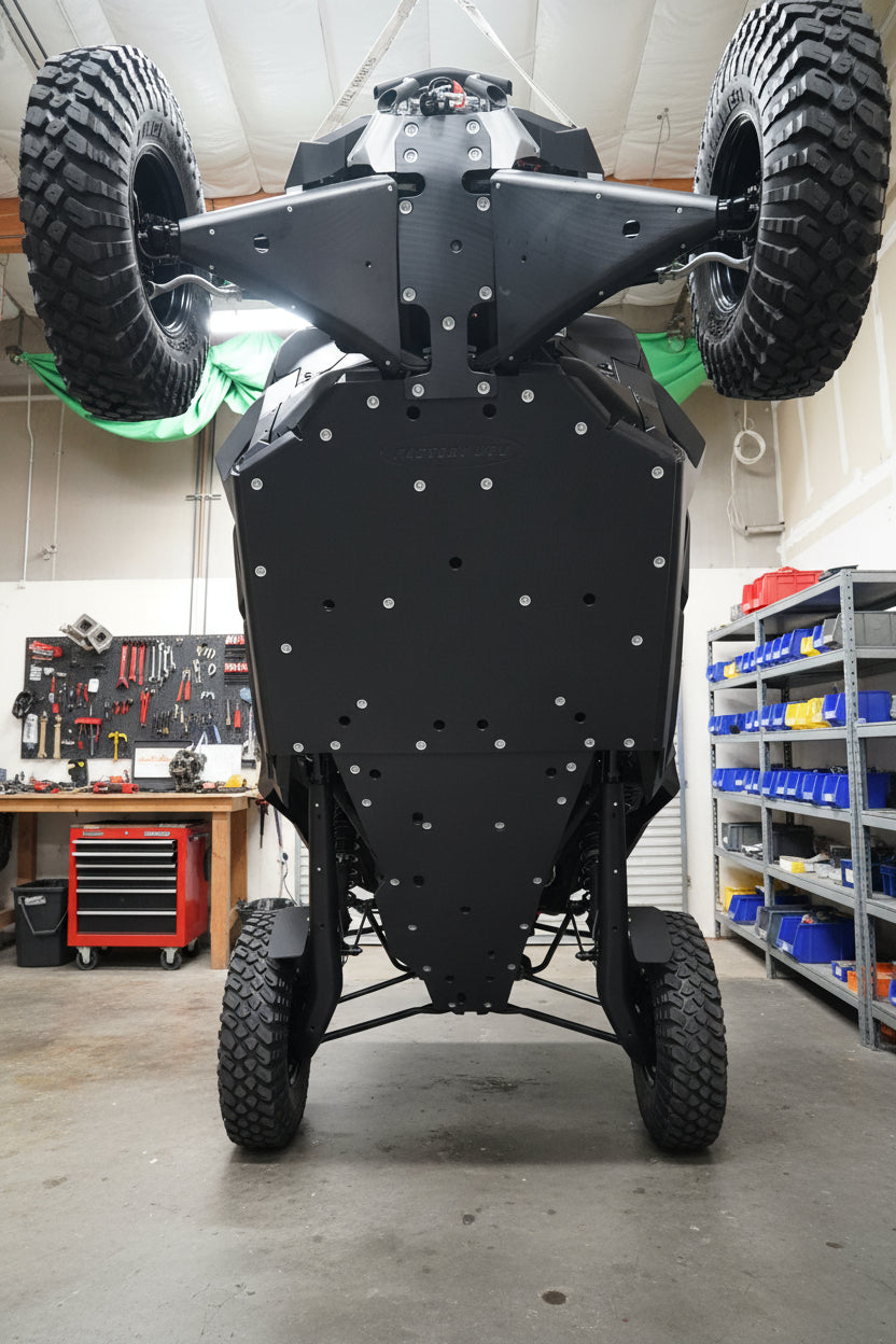 Factory UTV Ultimate UHMW Skid Plate Package installed on a Can-Am Maverick R showing complete undercarriage protection.