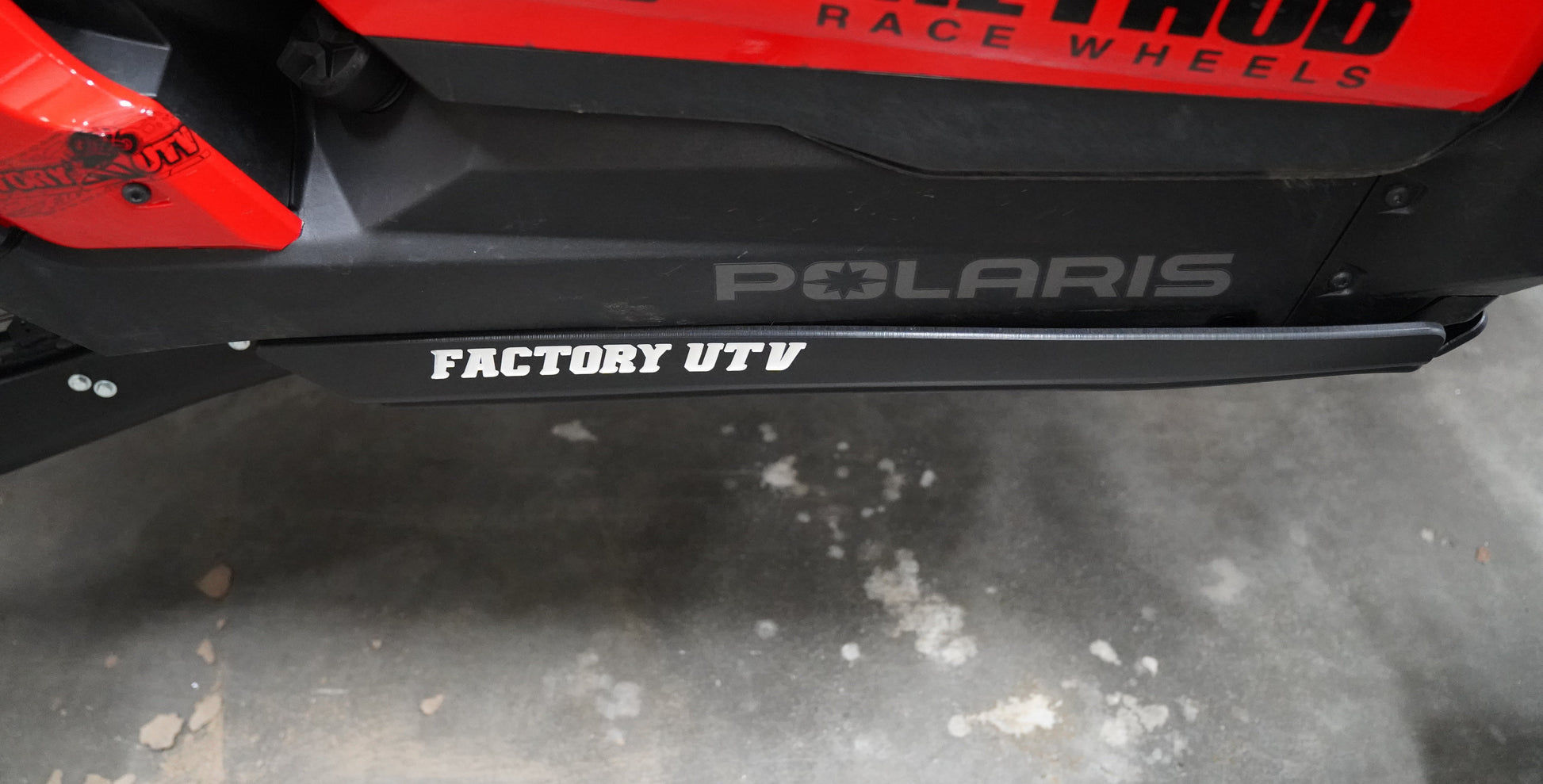 UHMW rock sliders installed on Polaris RZR XP S 1000 for side protection
