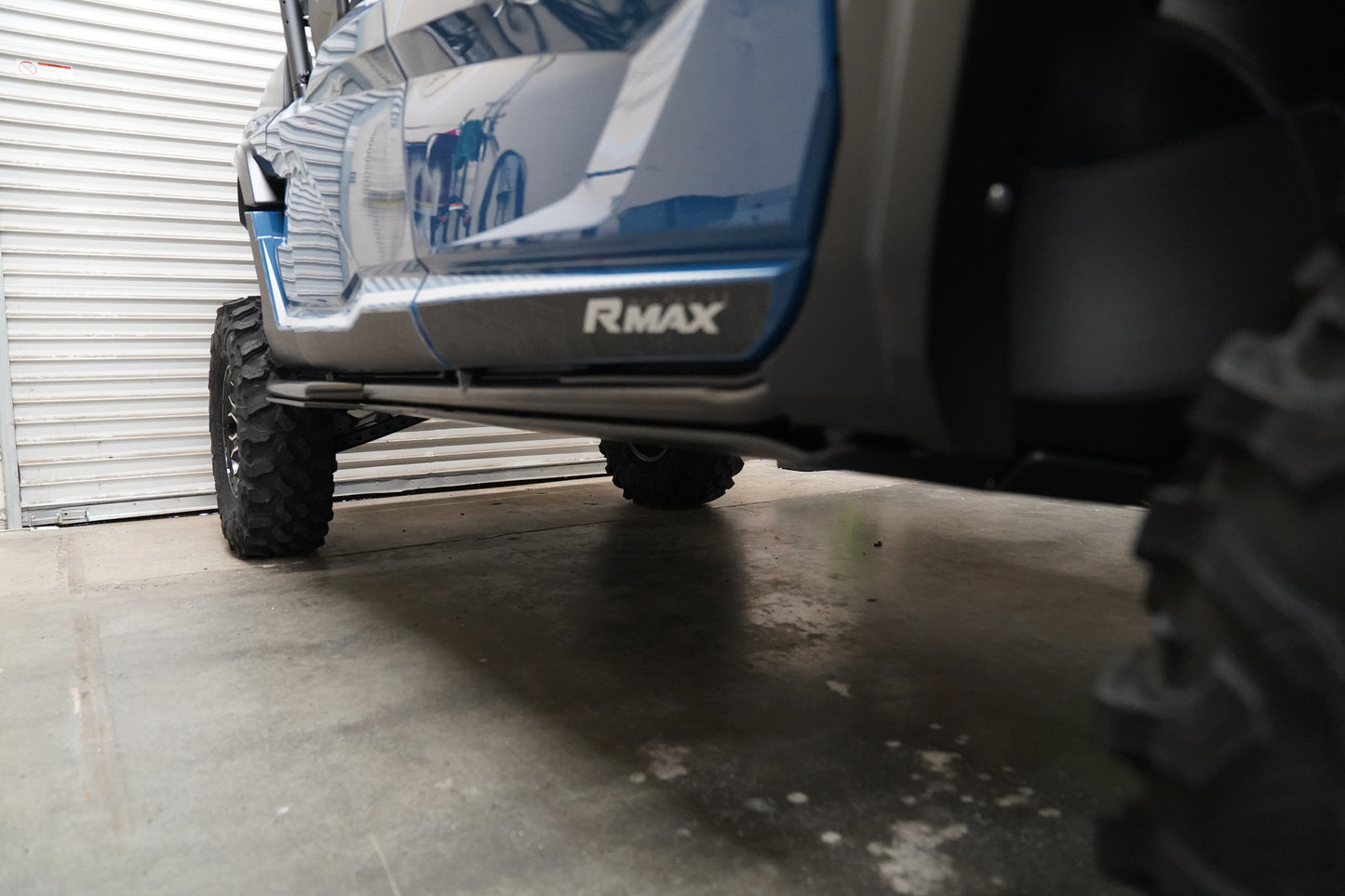 Yamaha Wolverine RMAX4 with UHMW skid plate on rugged off-road terrain