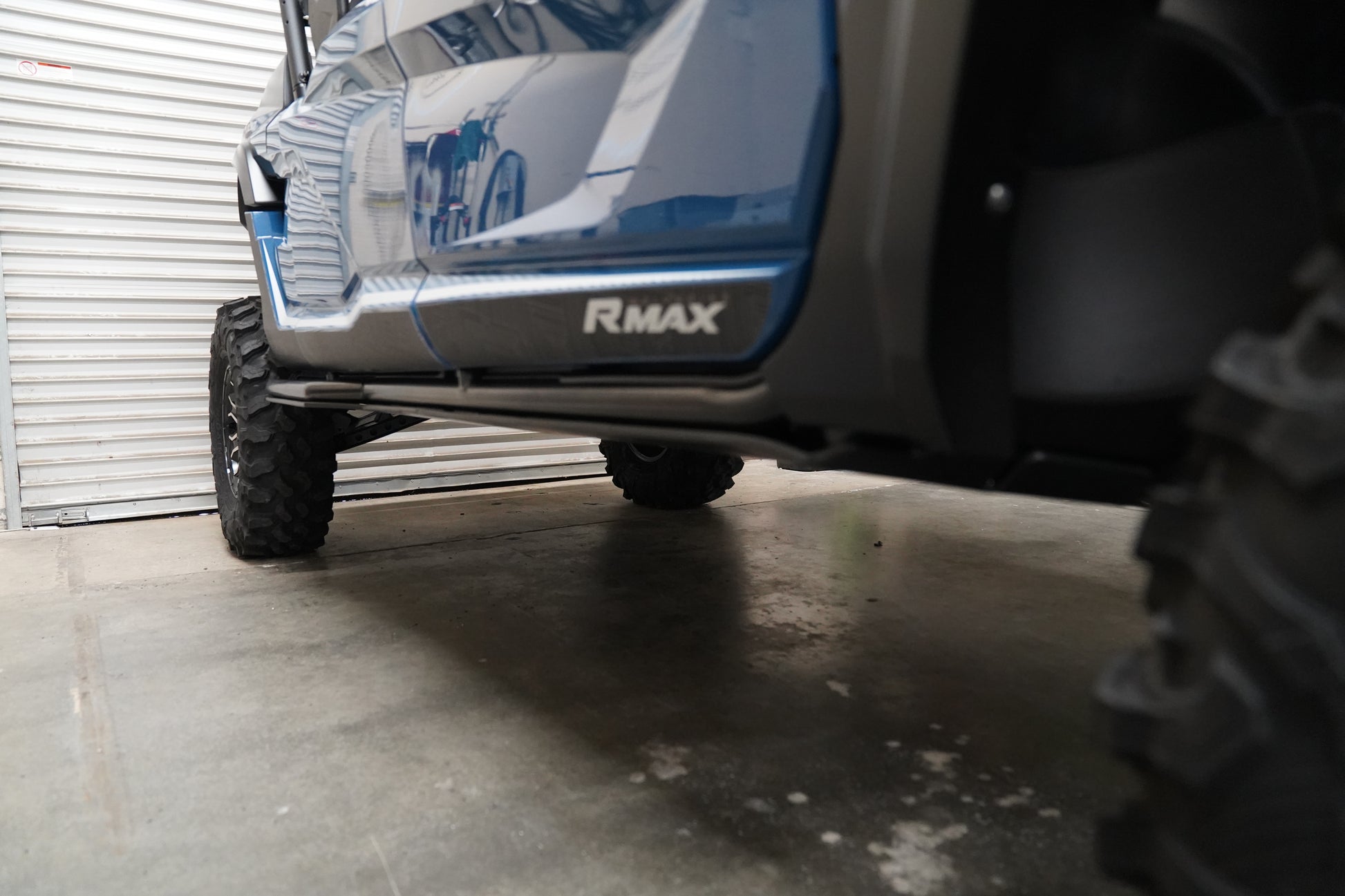 Yamaha Wolverine RMAX4 with UHMW skid plate on rugged off-road terrain
