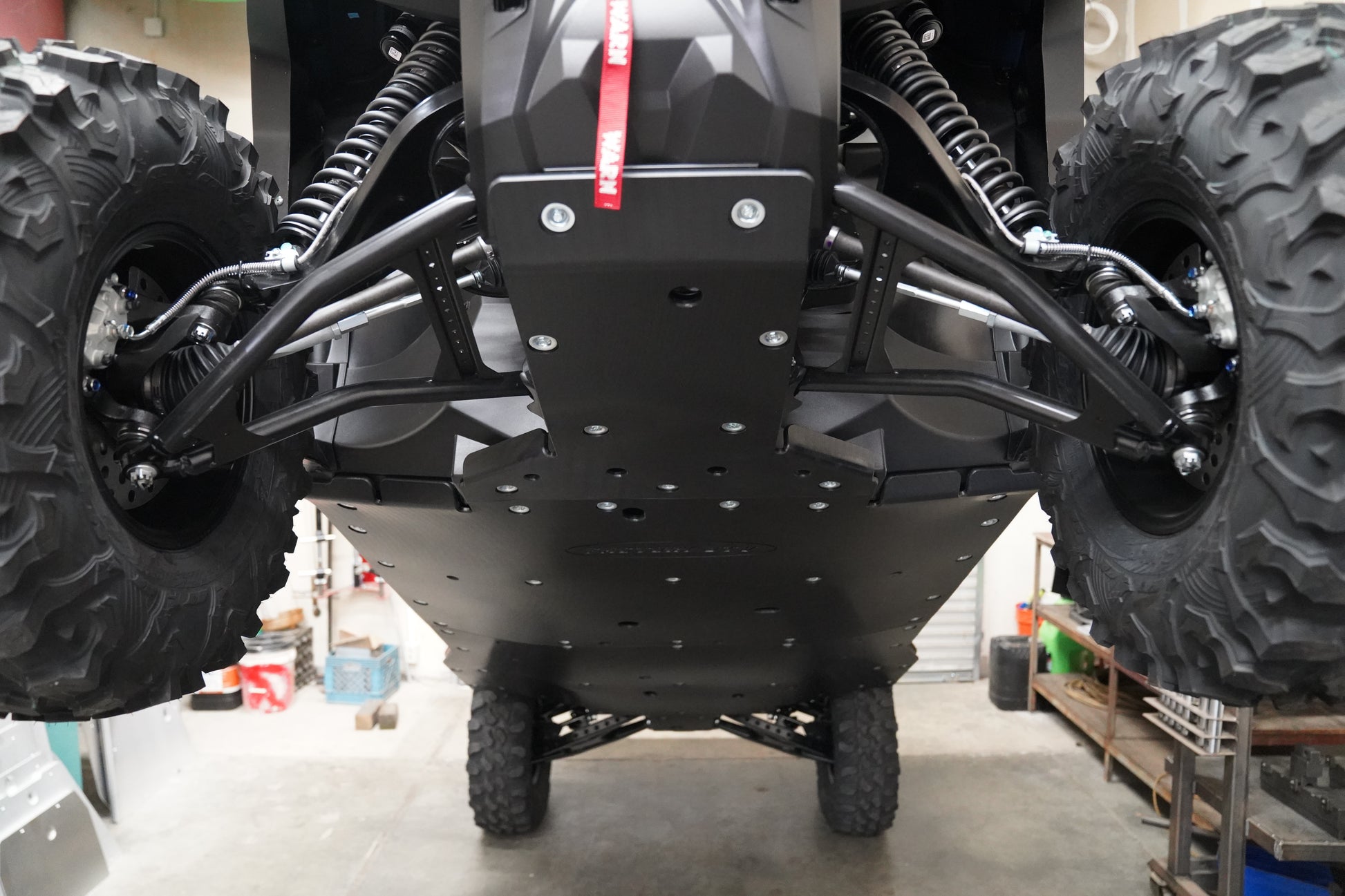 Close-up of UHMW material thickness on Yamaha Wolverine RMAX4 skid plate